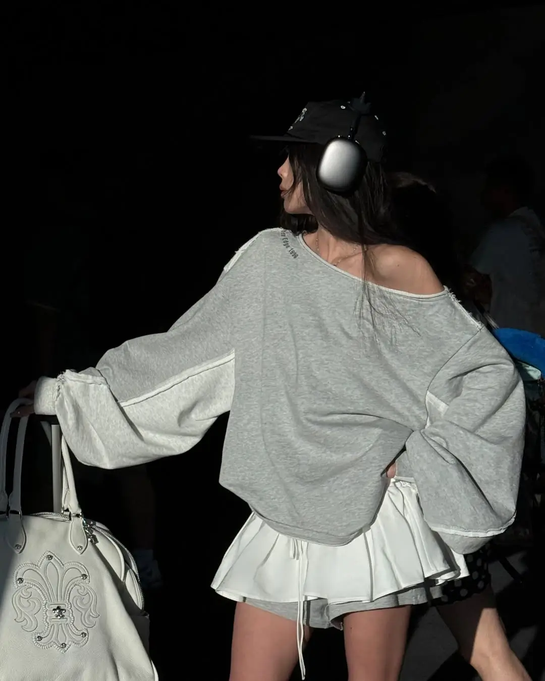 comfy airport outfits summer 2026 Oversized Sweatshirt and Mini Skirt Balance