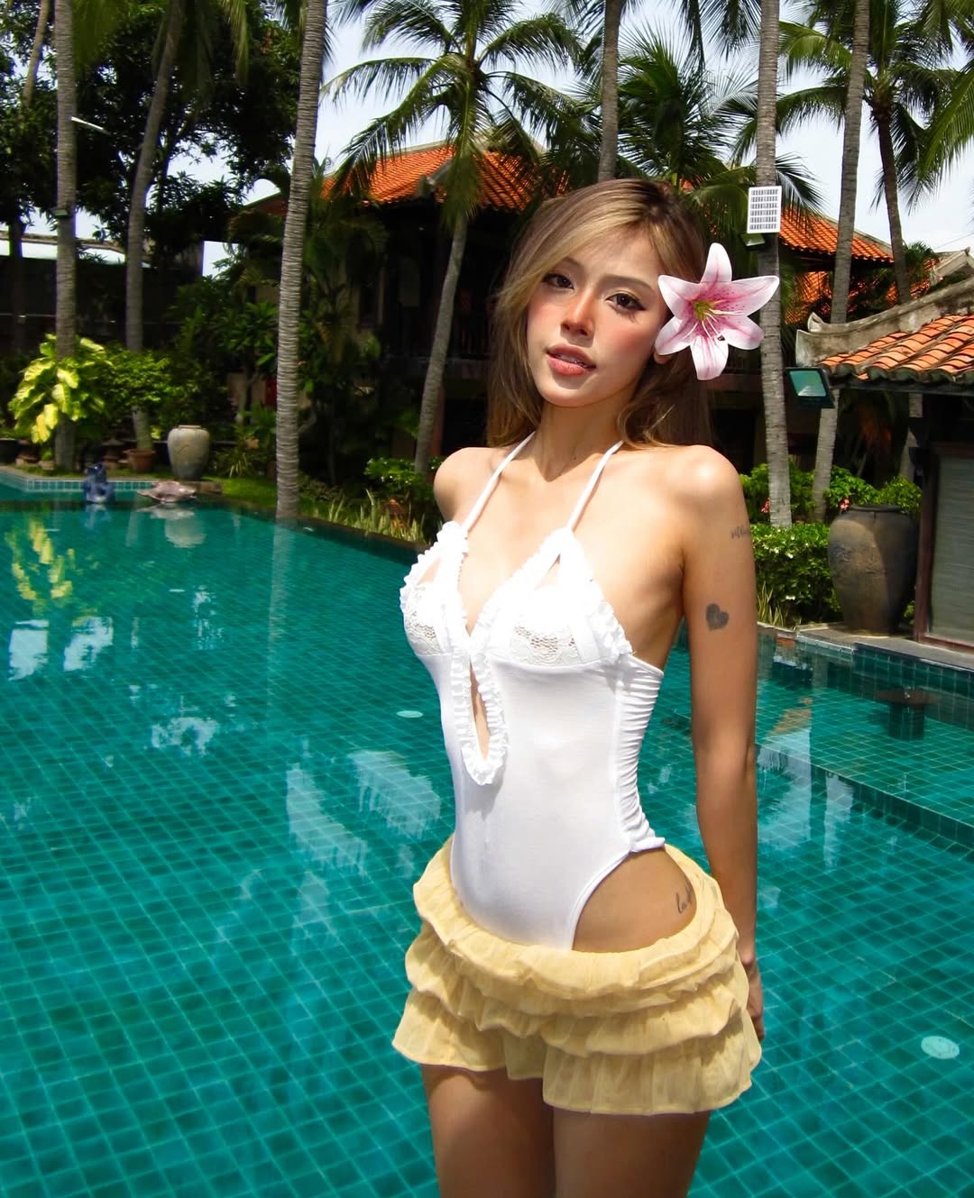 summer bodysuit outfits for women 2026 White Bodysuit and Soft Skirt Vacation Ease Done Right