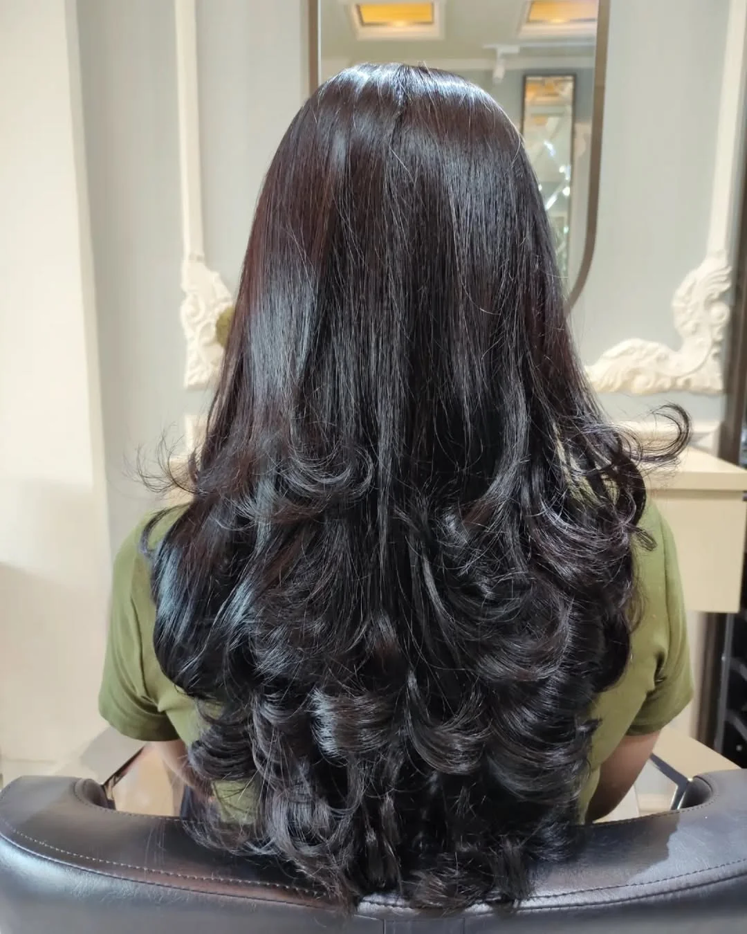chic summer haircuts for long hair 2026 Glossy Black Layers With Dramatic Bounce