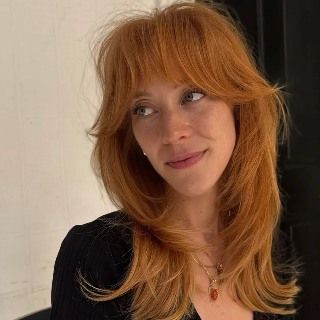 chic summer haircuts for long hair 2026 Soft Ginger Layers With Wispy Curtain Bangs