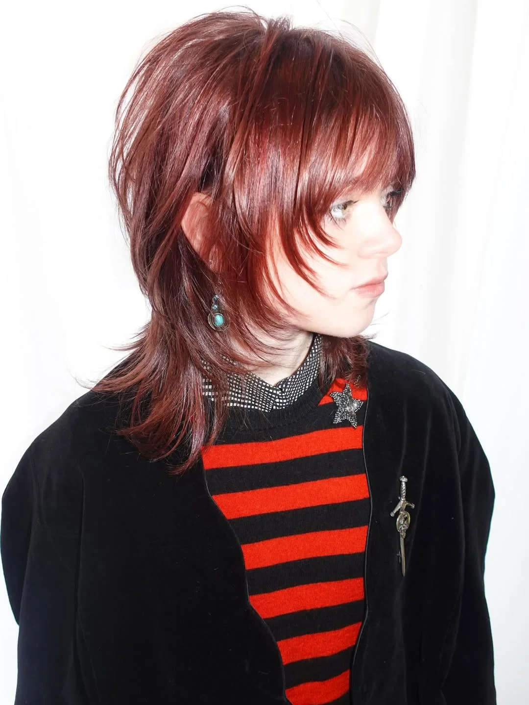 feathered summer haircuts for medium hair 2026 Cherry Cola Feather Shag With Retro Edge