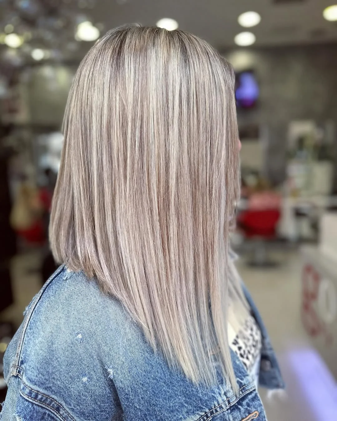 feathered summer haircuts for medium hair 2026 Cool Blonde Precision With Feathered Ends