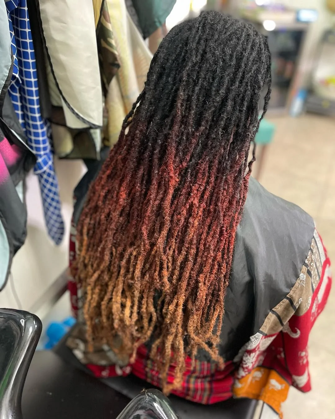 flattering summer ombre hair color 2026 Textured Loc Ombre with Burnt Copper Ends