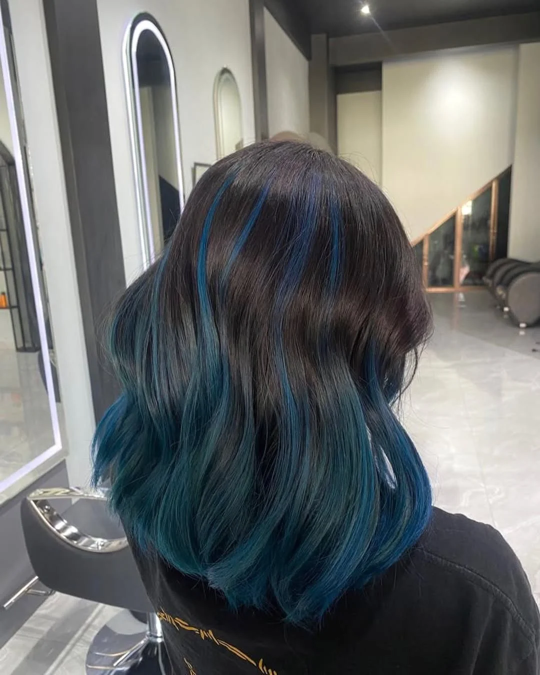 flattering summer ombre hair color 2026 Deep Teal Ombre on Layered Dark Base