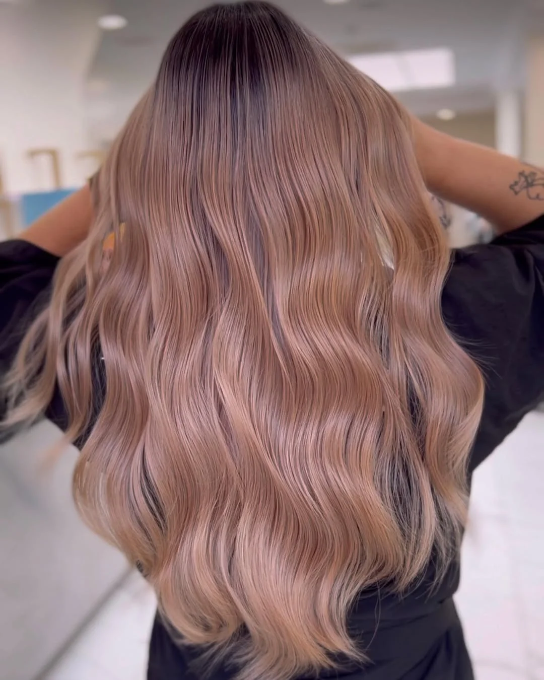 flattering summer ombre hair color 2026 Muted Rose Beige Ombre on Soft Waves