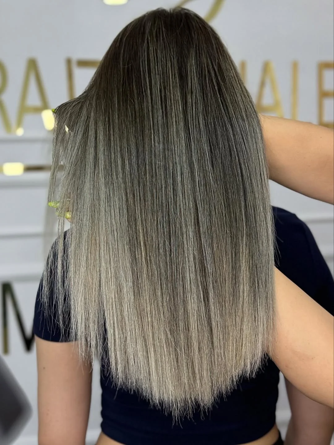 flattering summer ombre hair color 2026 Cool-Toned Ash Fade for Ultra Sleek Lengths
