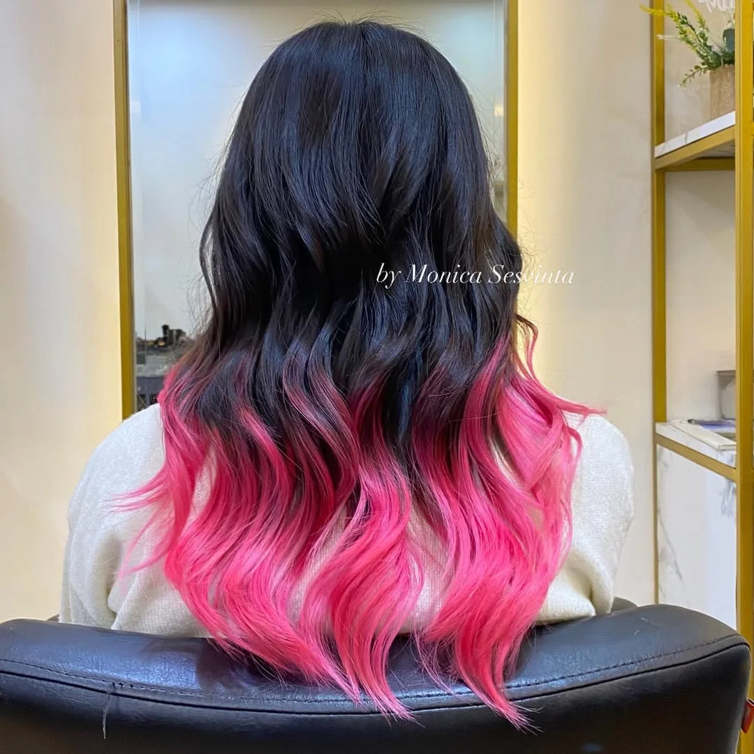 flattering summer ombre hair color 2026 Electric Pink Dip-Dye on Soft Waves