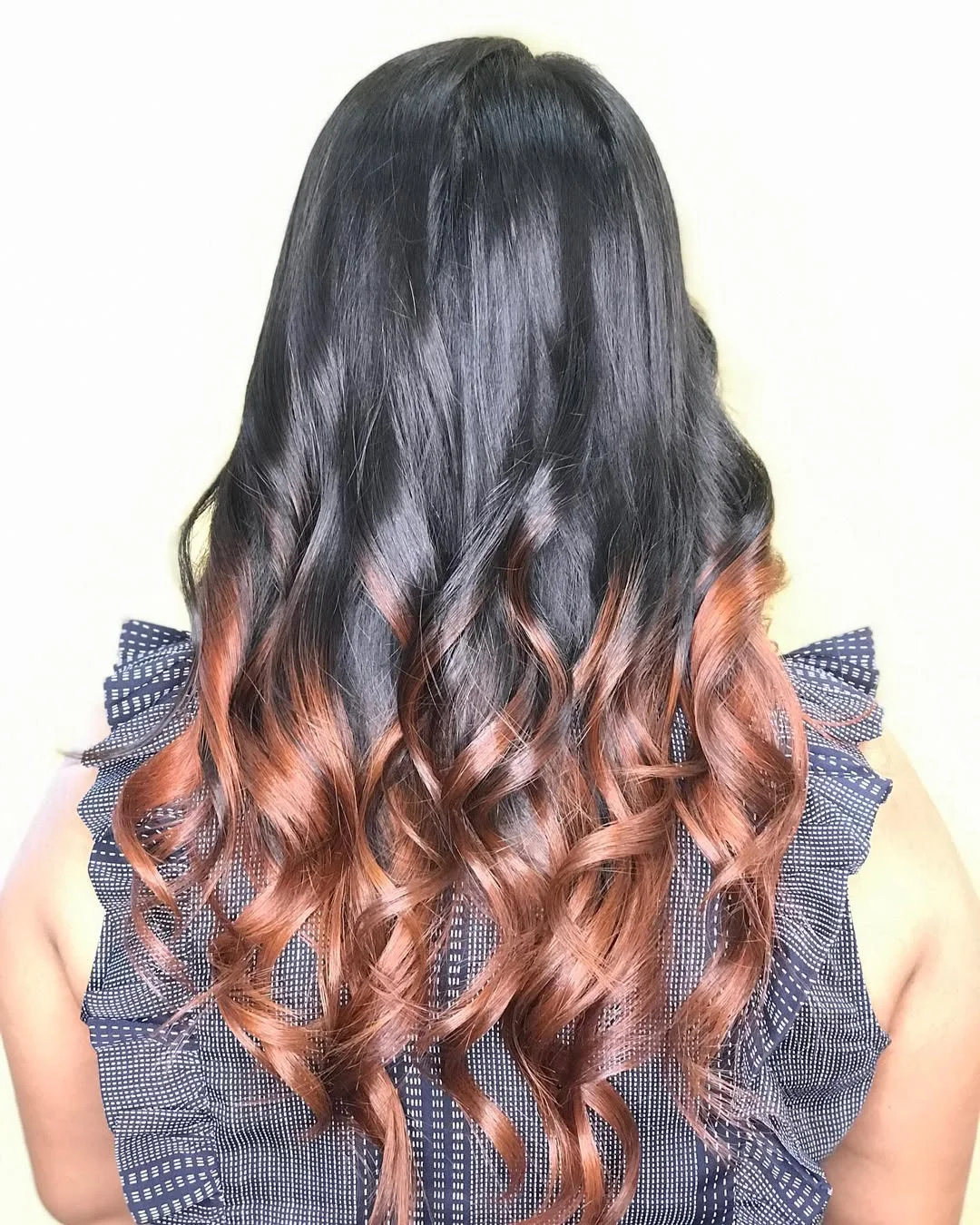 flattering summer ombre hair color 2026 Classic Black to Caramel Curl Melt