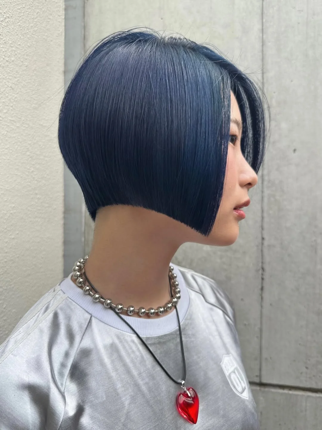 summer bob haircut 2026 Sharp Midnight Blue Angled Bob with Glossy Depth