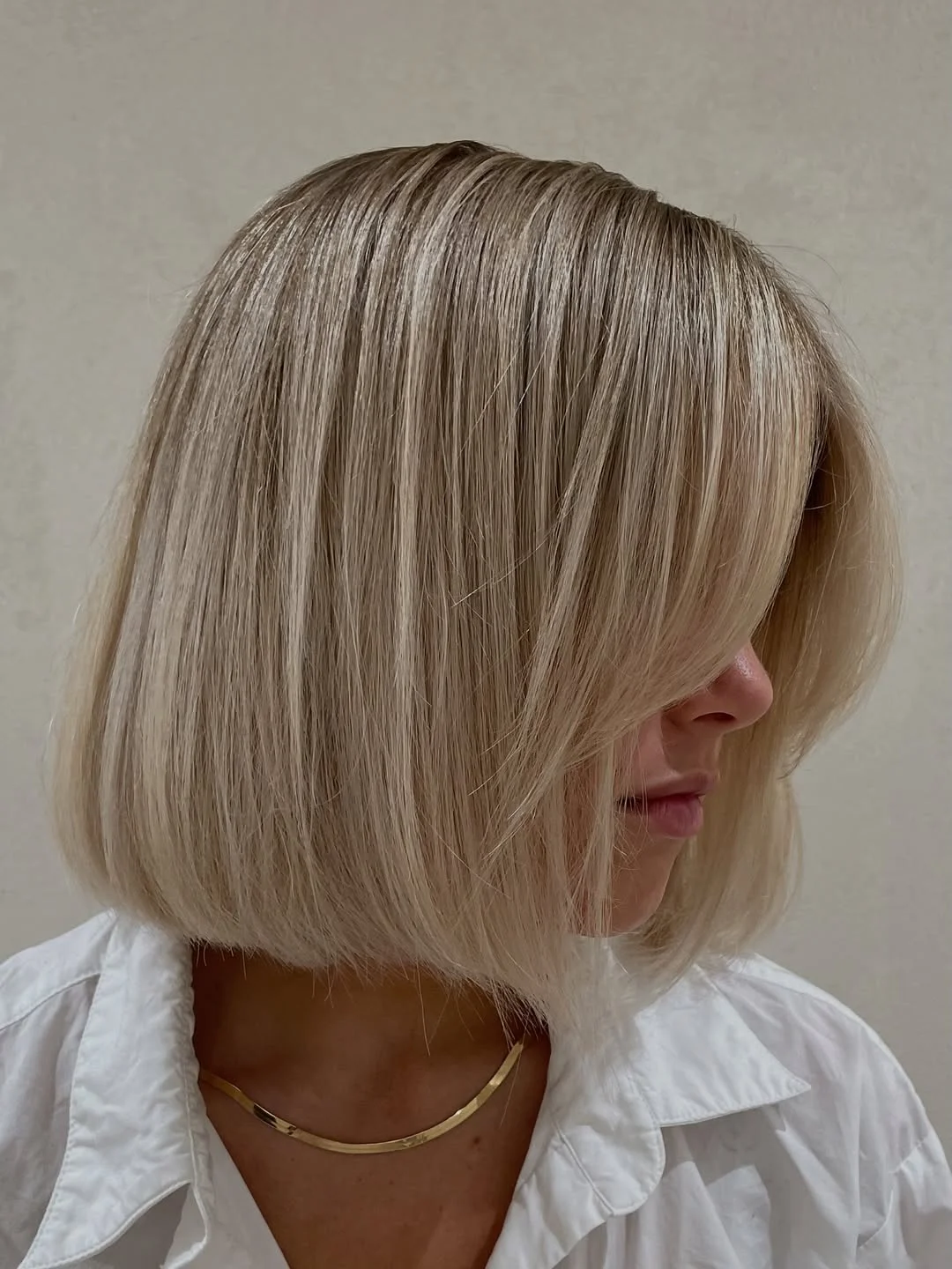 summer bob haircut 2026 Soft Blonde Rounded Bob with Feathered Front