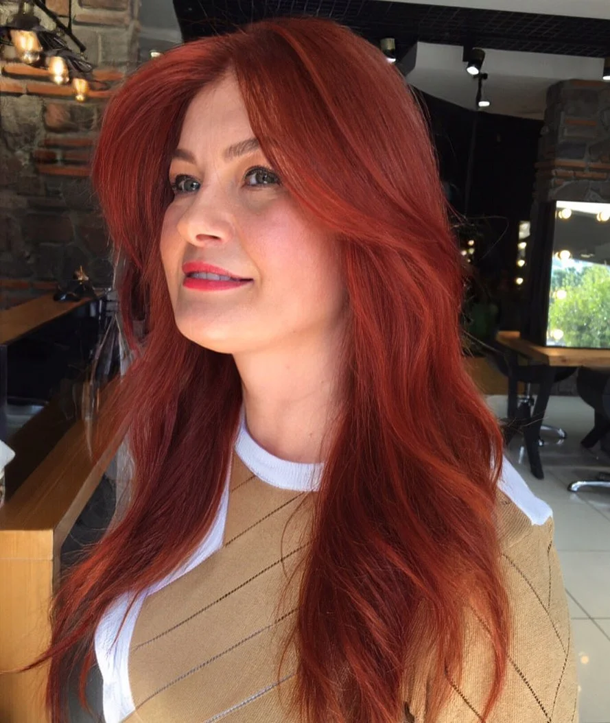 fresh summer haircuts for thin fine hair 2026 Rich Copper Layers With Voluminous Summer Movement