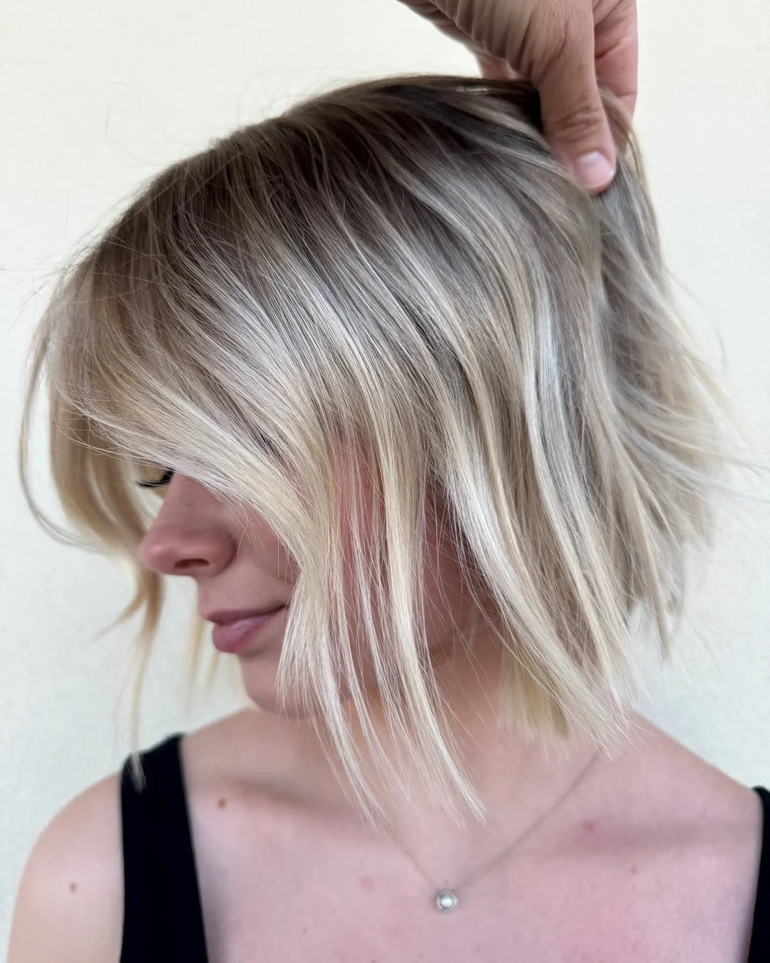 glossy summer blonde hair color 2026 Cool Rooted Blonde Bob with Light Contrast Ends