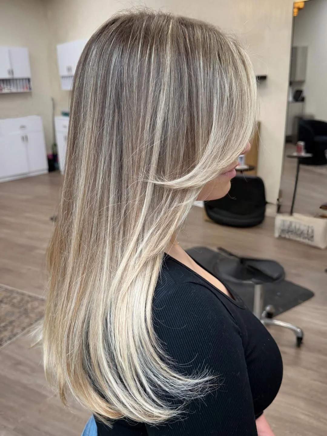 glossy summer blonde hair color 2026 Layered Cool Blonde with Feathered Ends and Airy Movement