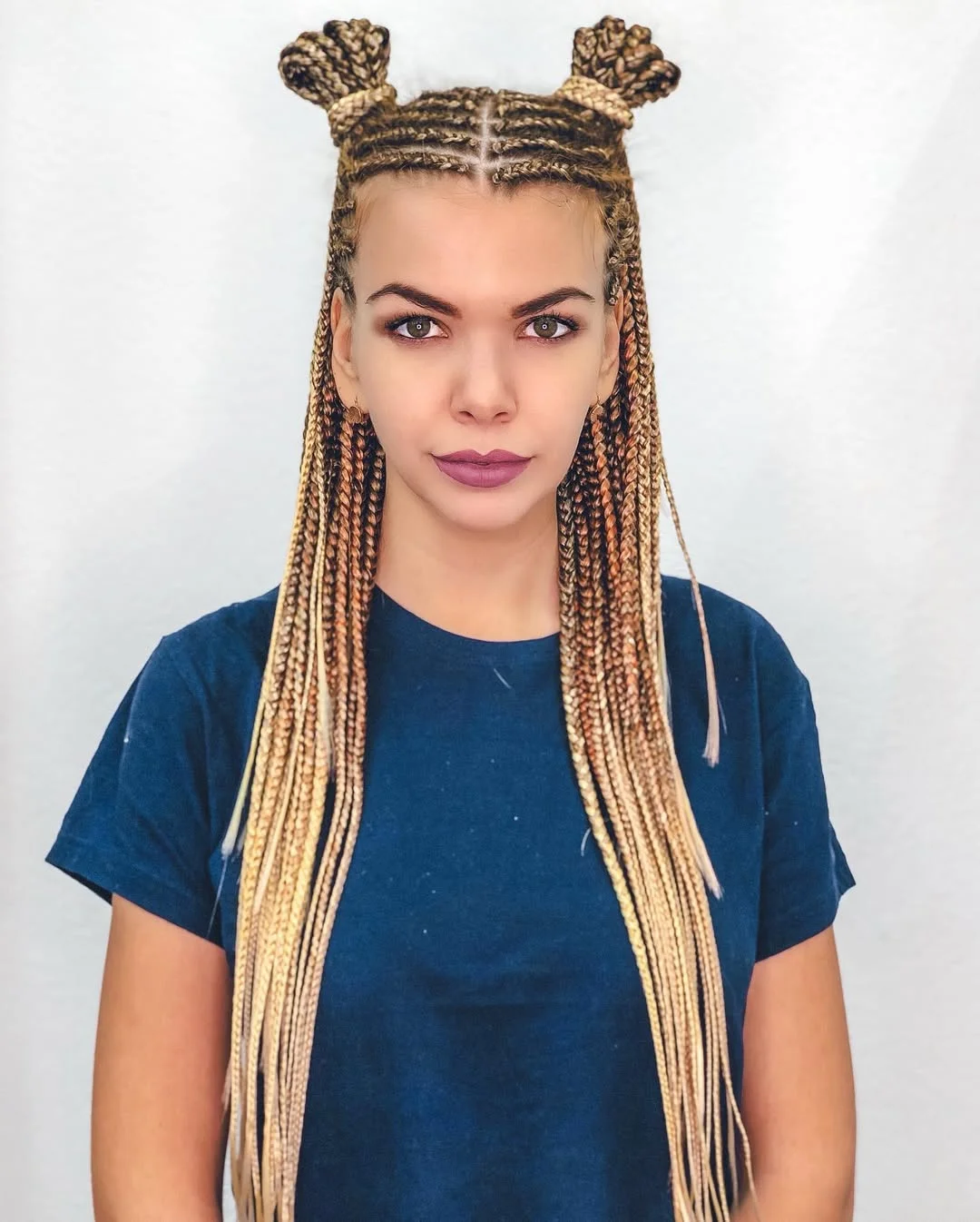 intricate summer braids hairstyle 2026 Blonde Micro Braids With Space Bun Details