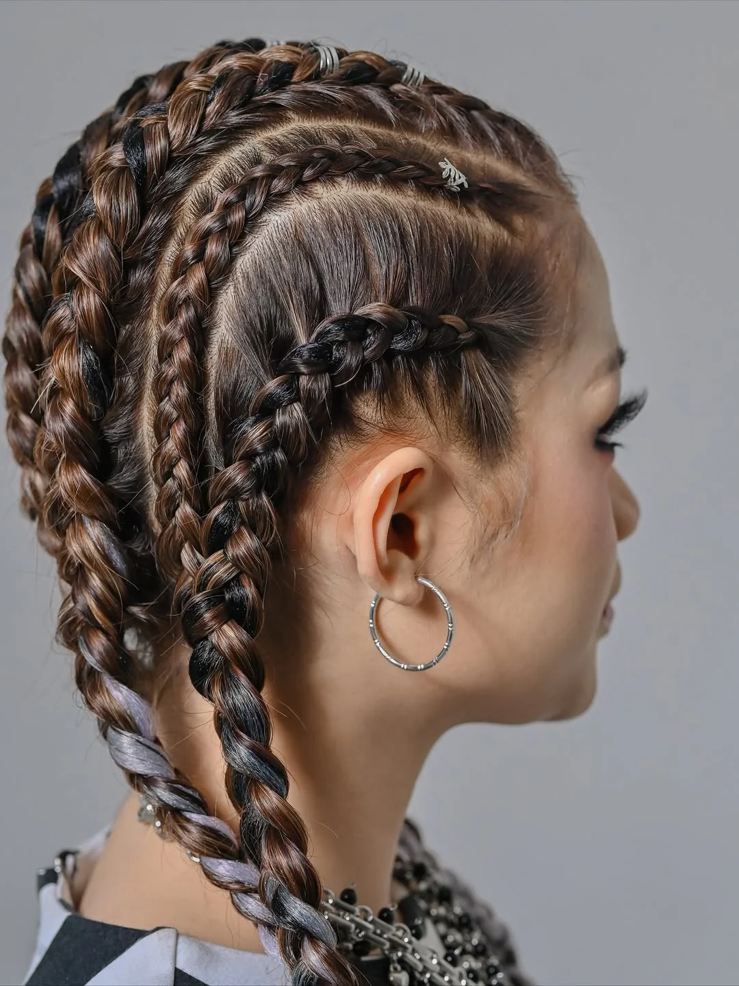 intricate summer braids hairstyle 2026 Layered Boxer Braids With Street Style Energy