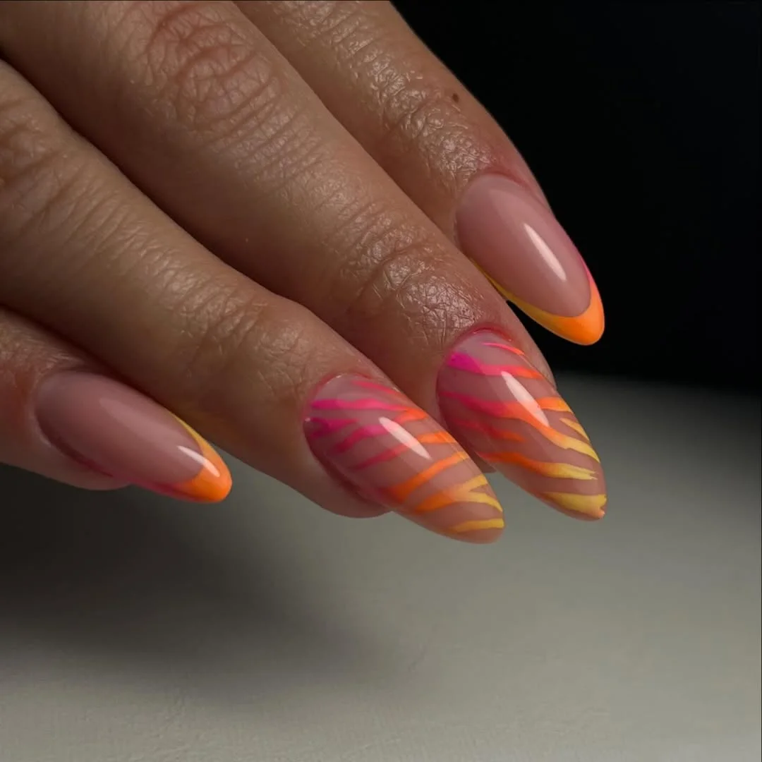 june nail colors 2026 Sunset Neon French Tips with Electric Zebra Lines