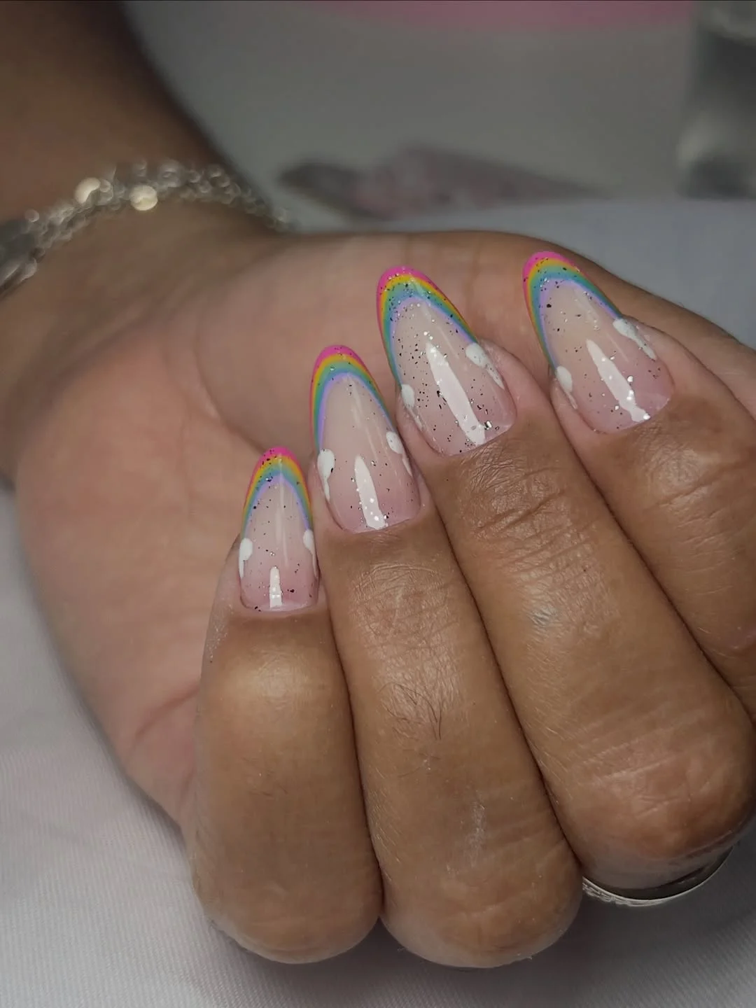 june nail colors 2026 Rainbow French Nails with Soft Glittery Clouds