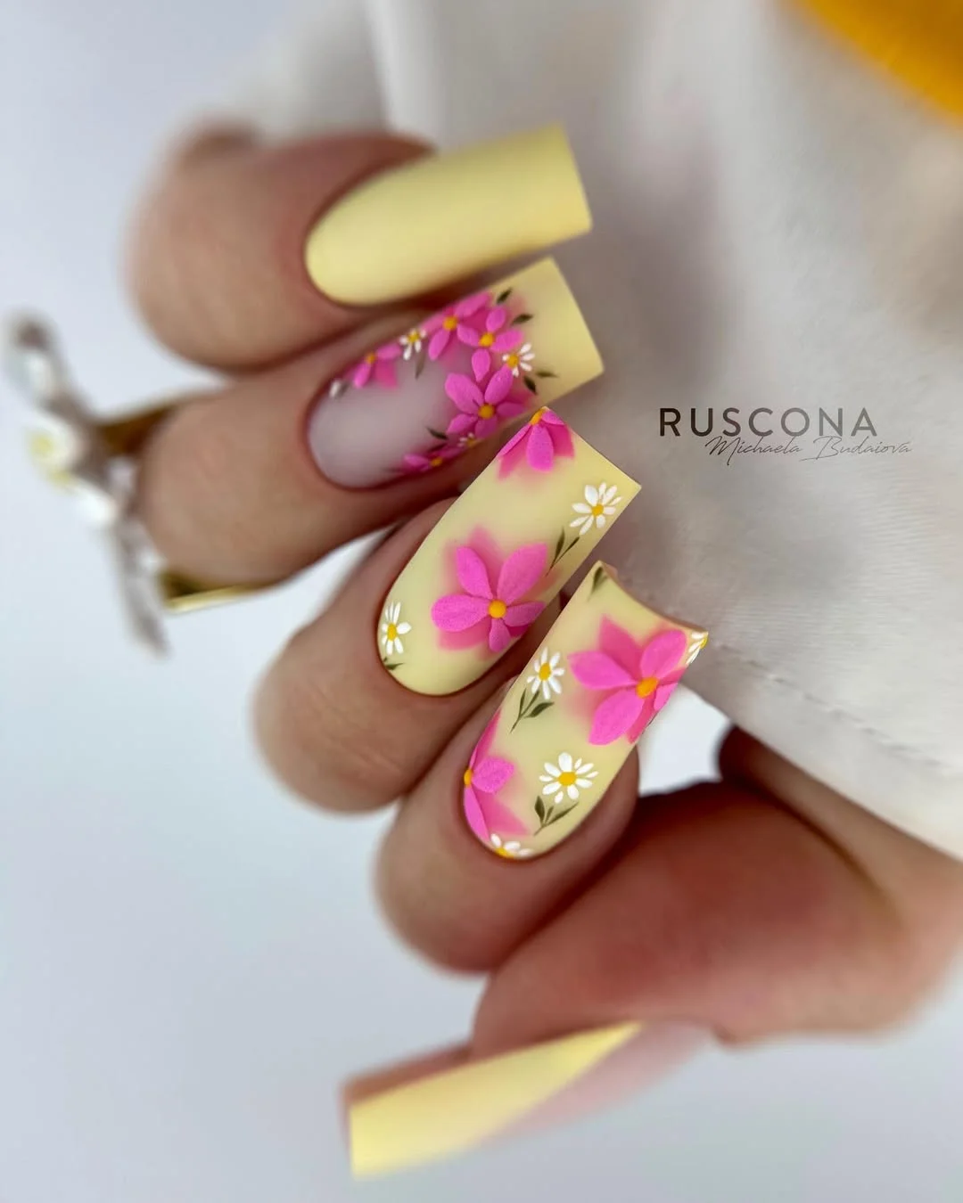 june nail colors 2026 Butter Yellow Floral Nails with Retro Summer Charm