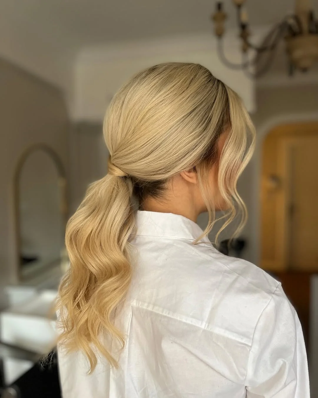 messy summer ponytail hairstyle 2026 Low Vanilla Blonde Ponytail With Relaxed Texture