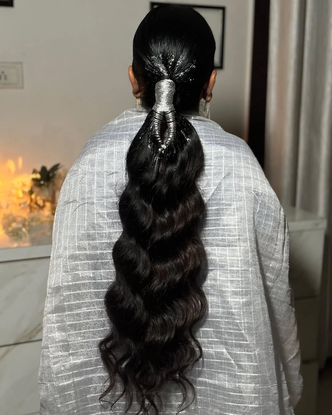 messy summer ponytail hairstyle 2026 Glossy Midnight Ponytail With Statement Silver Wrap
