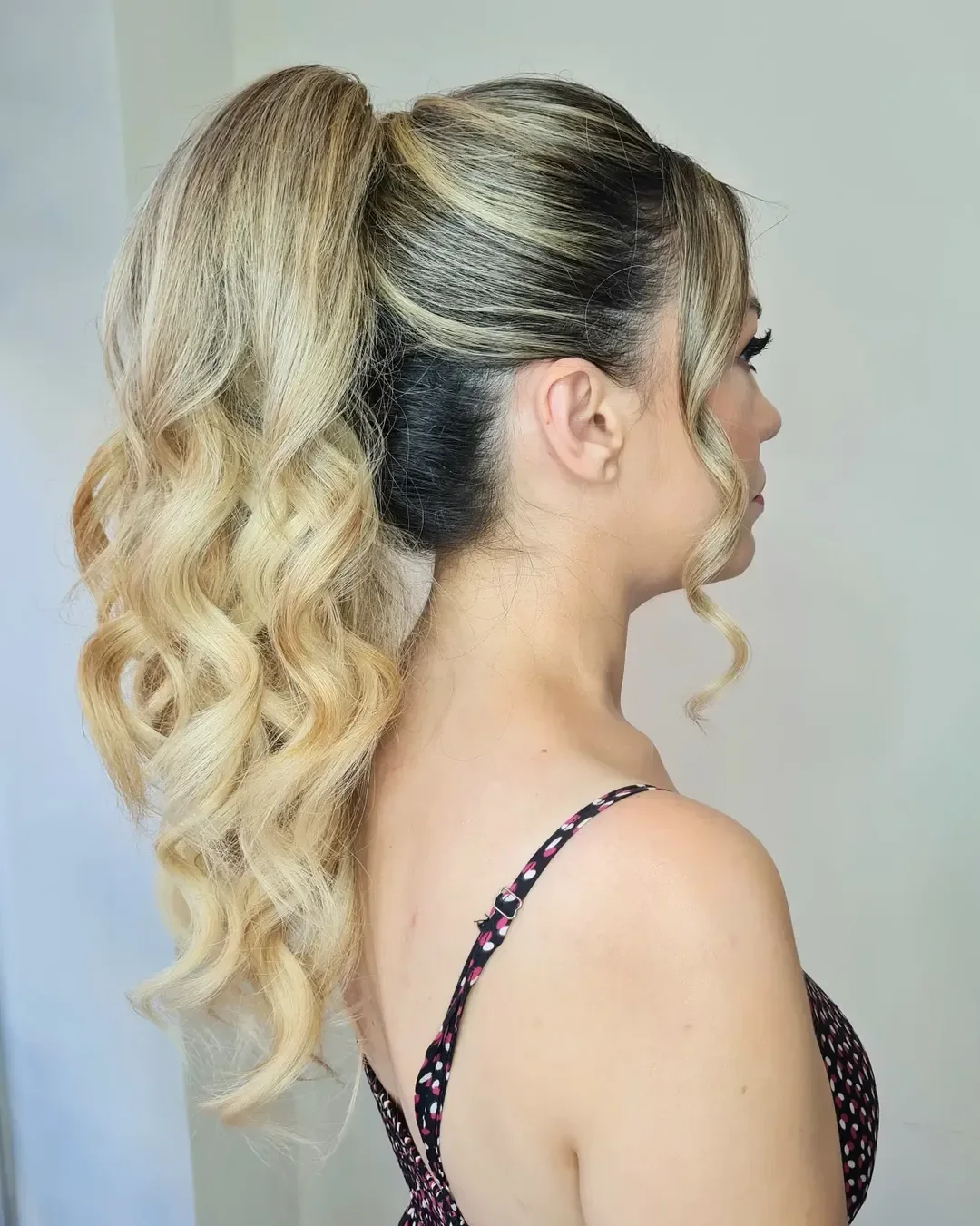 messy summer ponytail hairstyle 2026 High Blonde Ponytail With Bouncy Defined Curls