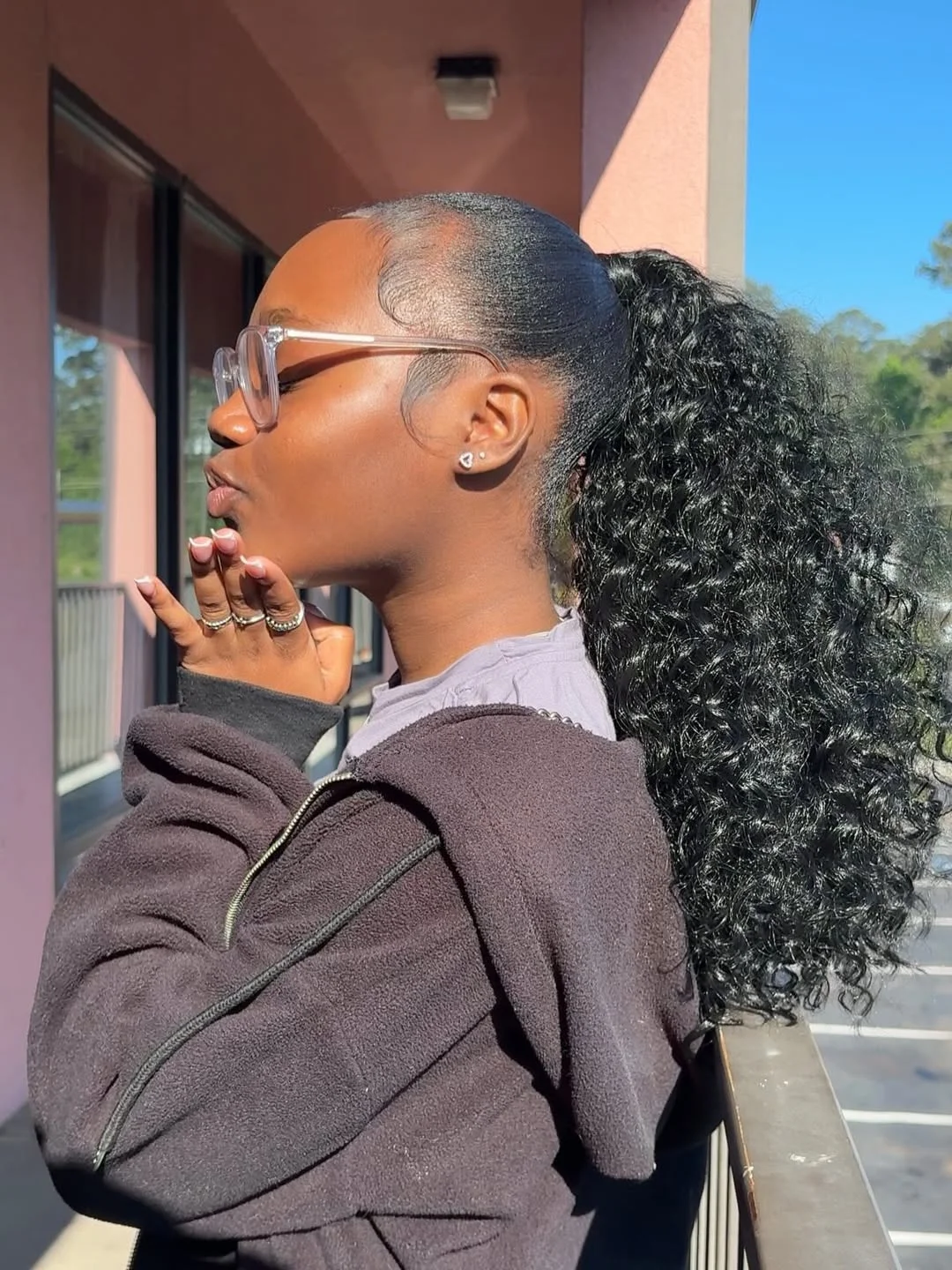 messy summer ponytail hairstyle 2026 Defined Curly Ponytail With Soft Edge Styling