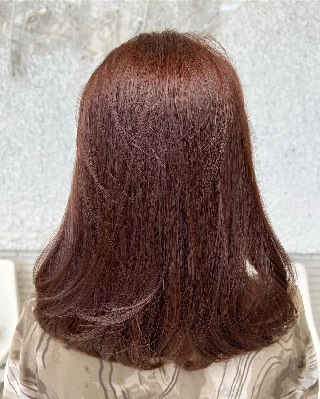 modern summer auburn hair color 2026 Muted Cocoa Auburn With Soft Rounded Ends