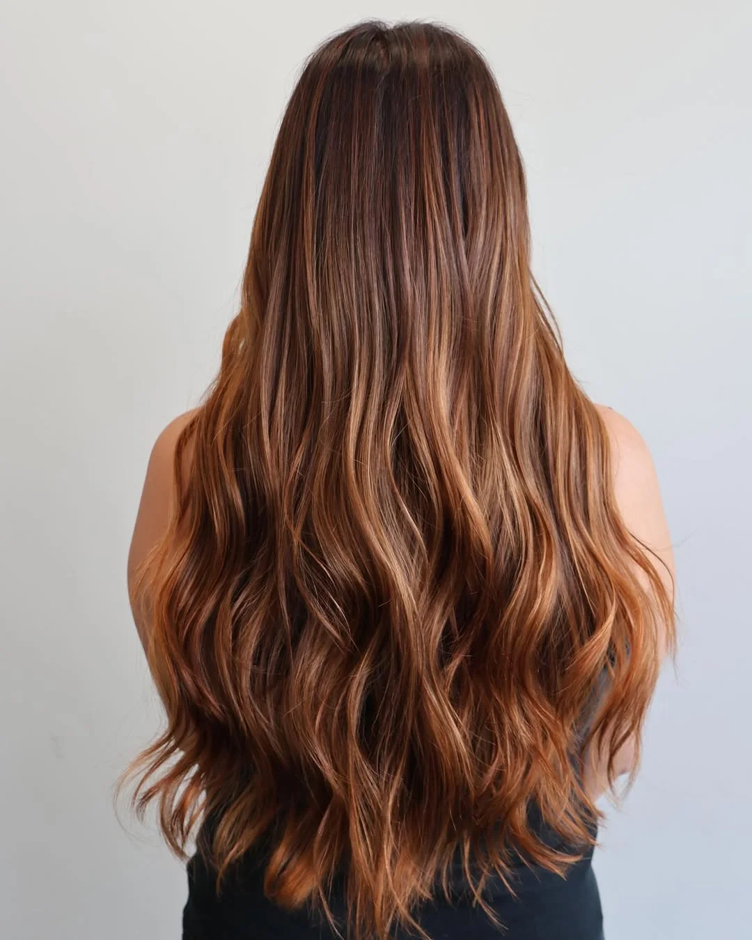 modern summer auburn hair color 2026 Warm Auburn Balayage With Honey Ribbon Highlights