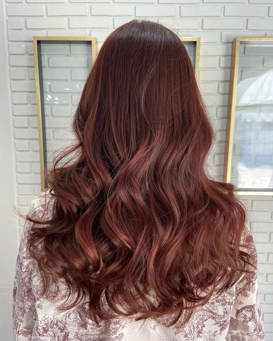modern summer auburn hair color 2026 Chocolate Cherry Auburn With Soft Glam Waves