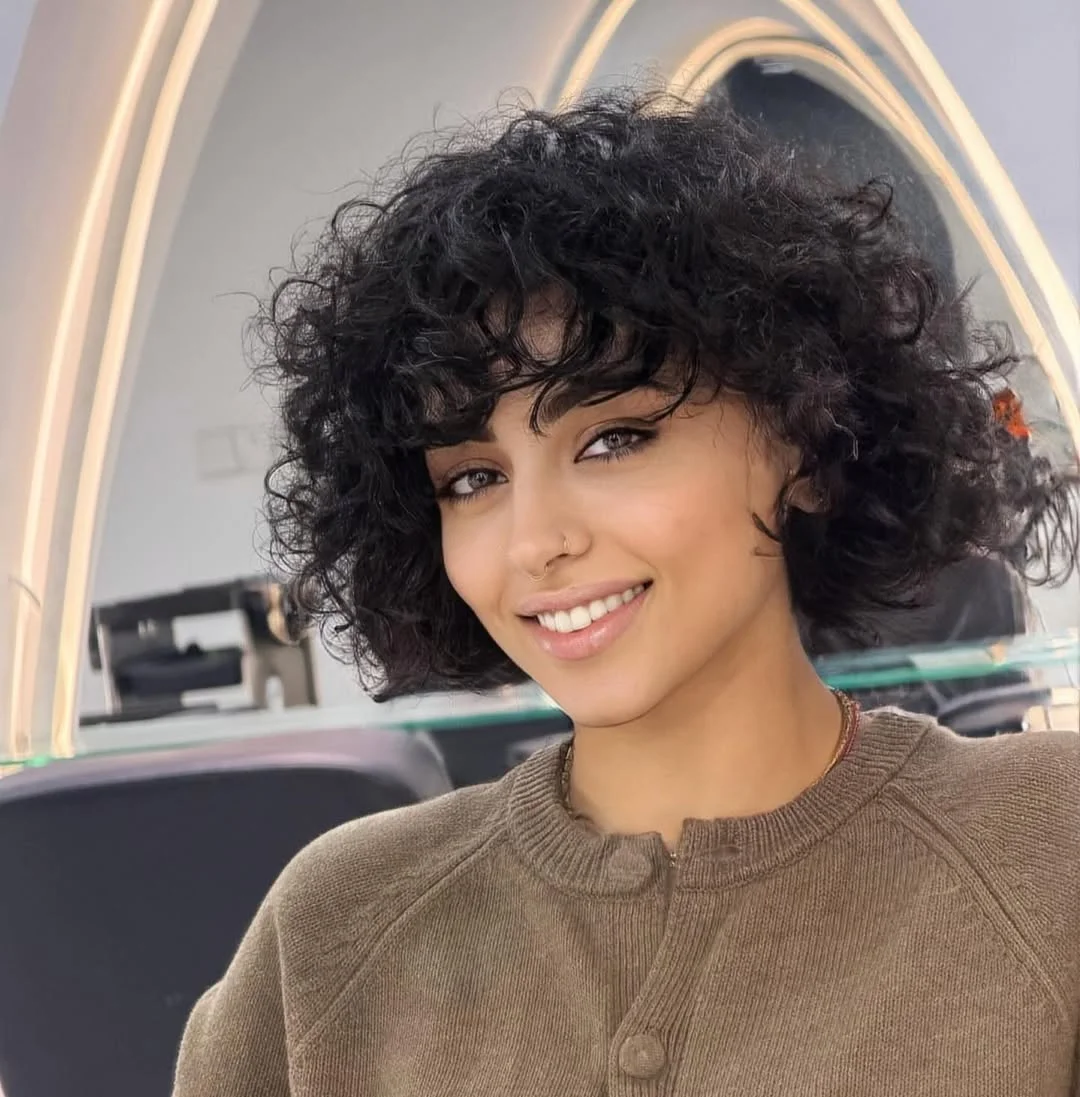 must-try summer haircut 2026 Curly Shag with Full Fringe Volume