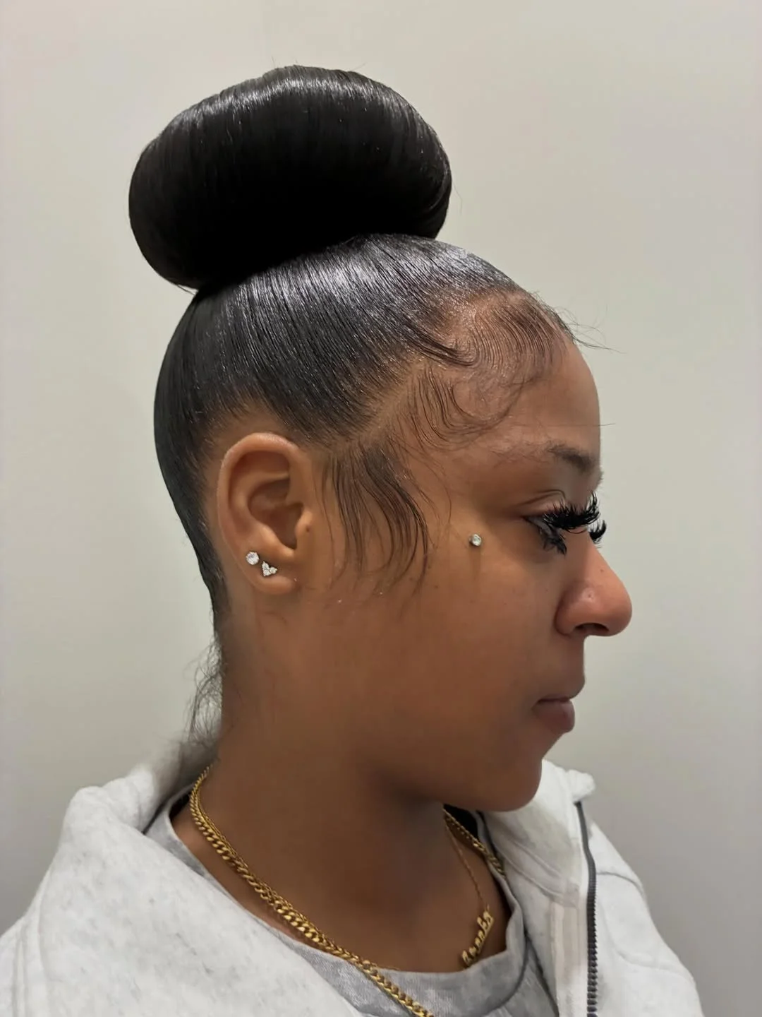 natural summer bun hairstyles 2026 Sleek High Bun With Clean Girl Summer Energy