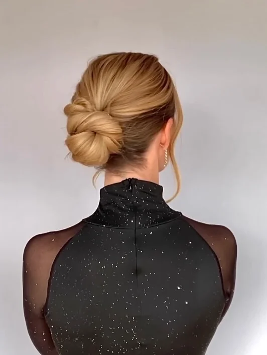 natural summer bun hairstyles 2026 Relaxed Twisted Bun For Warm Summer Evenings