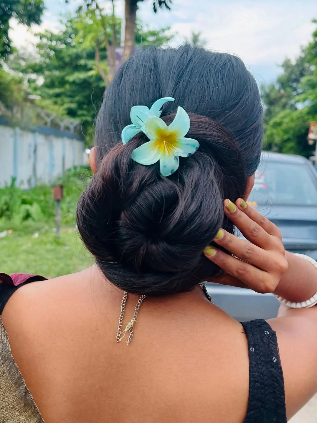 natural summer bun hairstyles 2026 Tropical Flower Bun With Vacation Energy