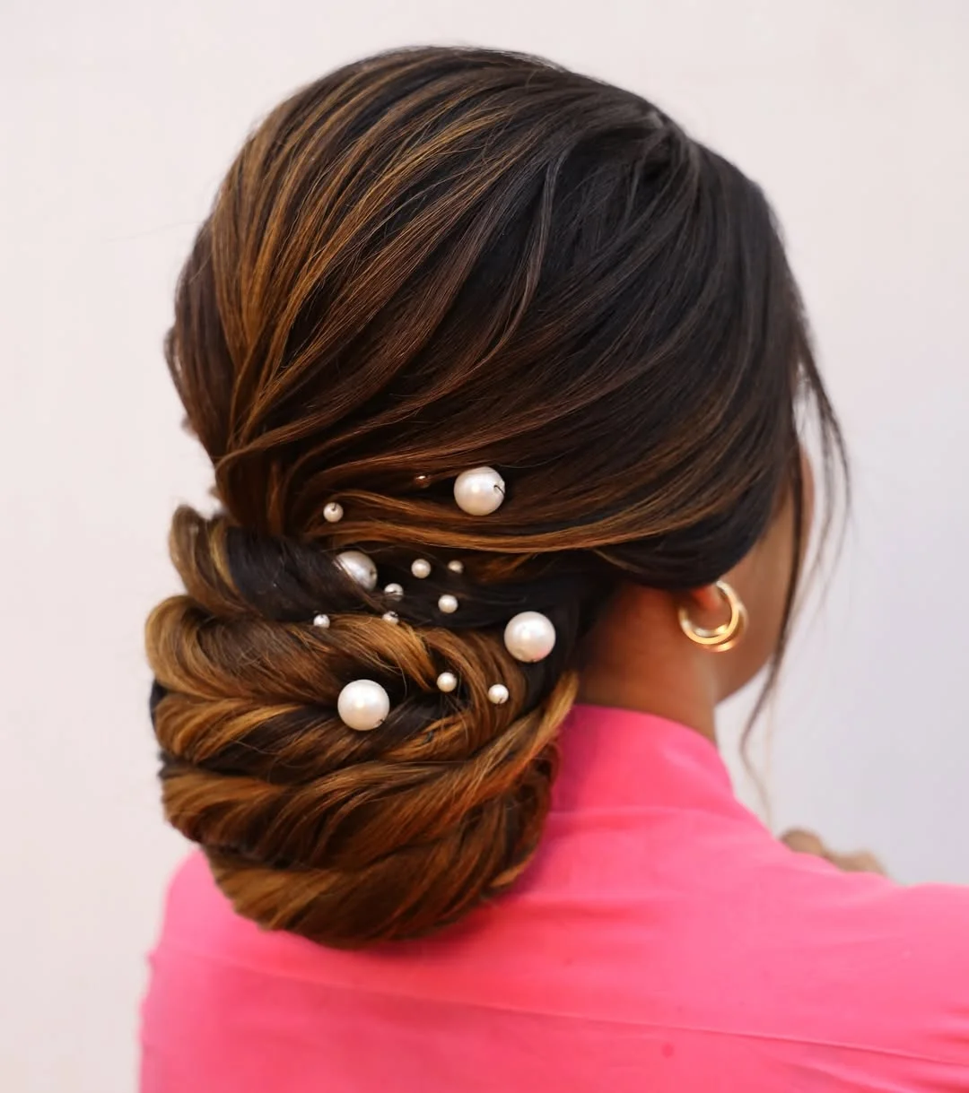 natural summer bun hairstyles 2026 Pearl Accented Twisted Bun For Warm Summer Nights