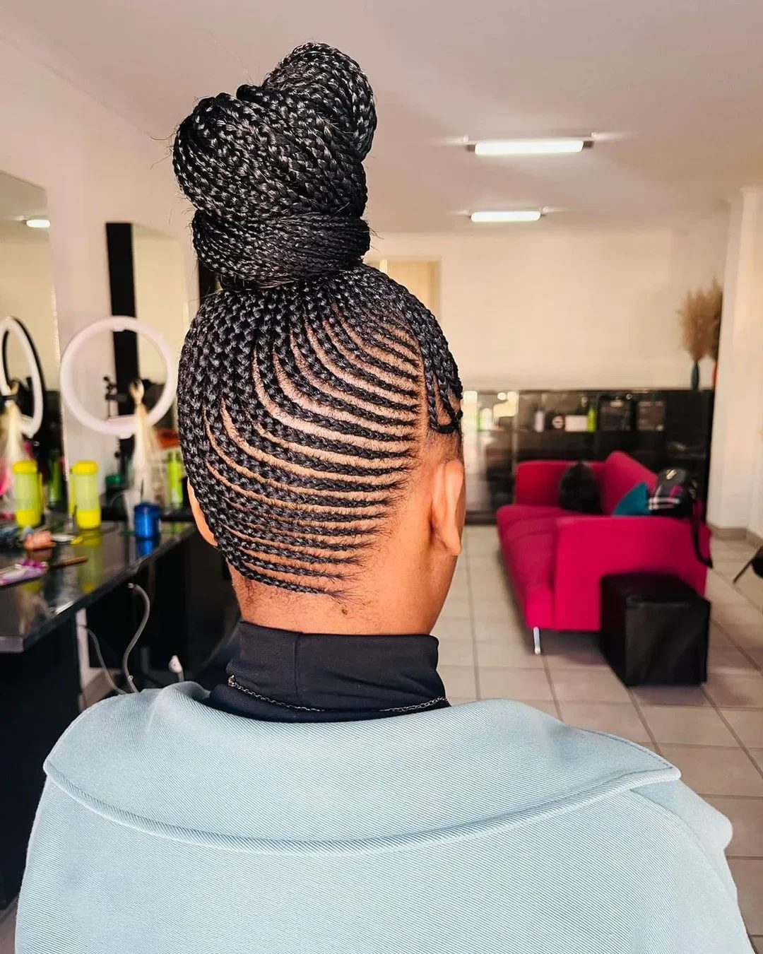 natural summer bun hairstyles 2026 Precision Braided Bun With Sculpted Summer Lines