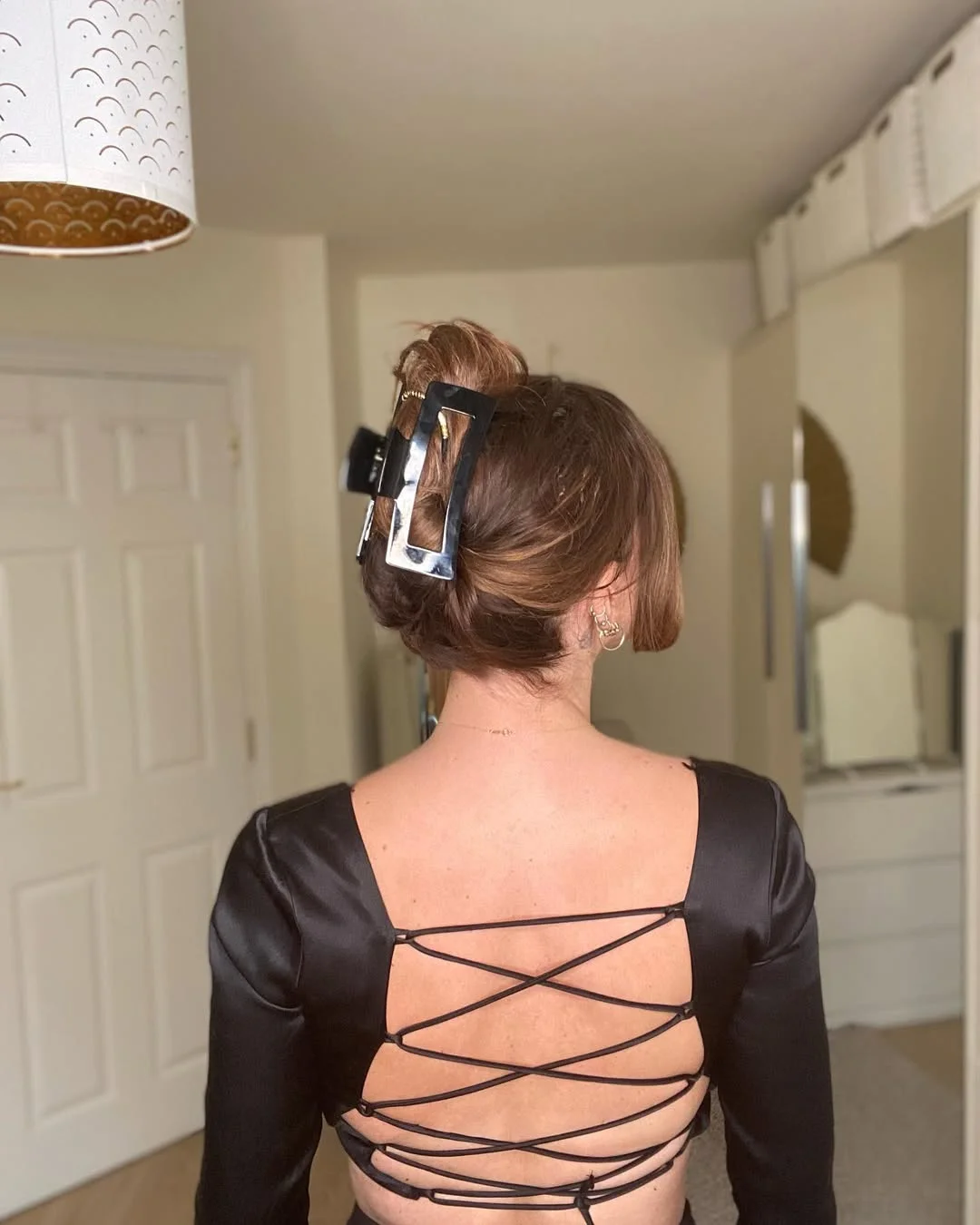 natural summer easy hairstyle 2026 Minimal Claw Clip Updo for Hot Summer Nights