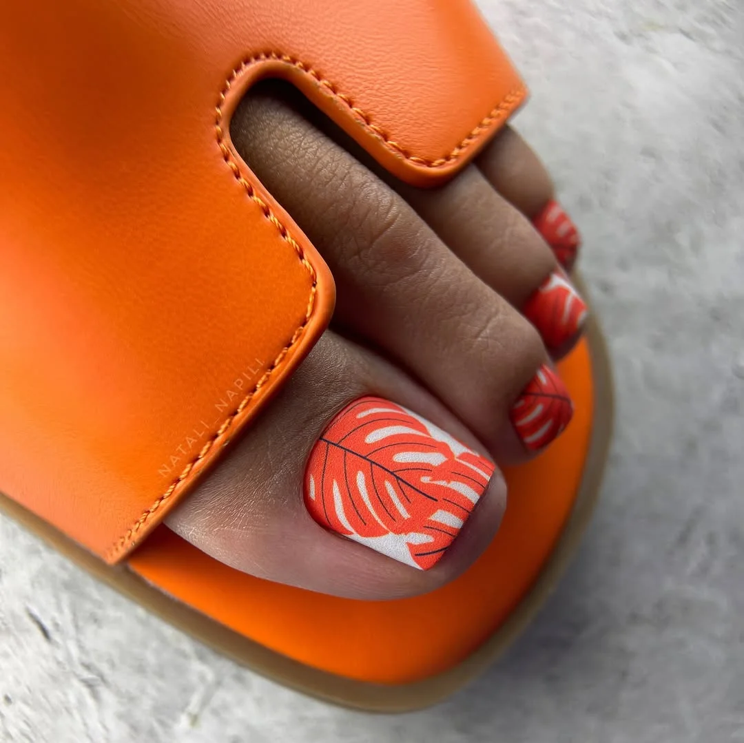 pedicure ideas - summer trends 2026 Tropical Coral Leaf Prints Made For Endless Summer Trips
