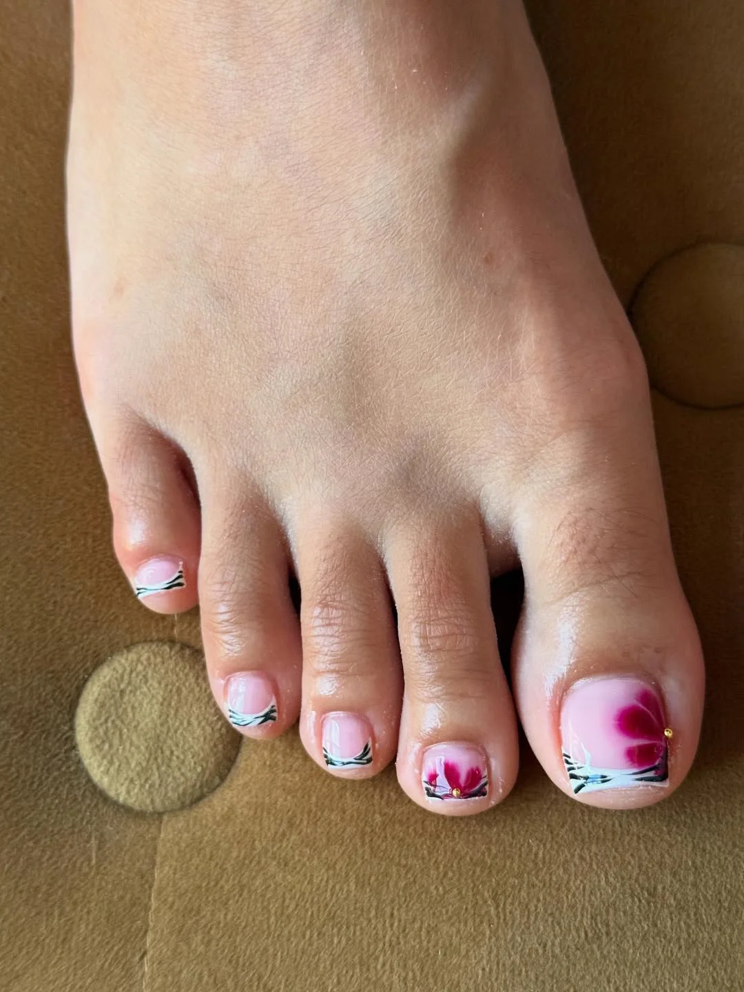 pedicure ideas - summer trends 2026 Floral Minimalist Pedicure With Soft Japanese-Inspired Details
