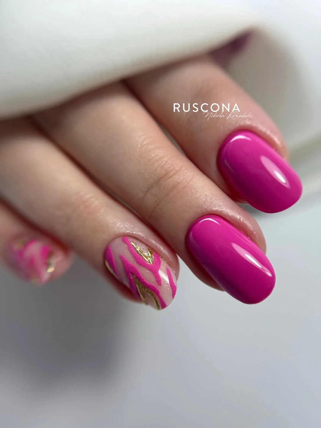 pink summer nails 2026 Glossy Fuchsia Nails with Gold Marble Accents