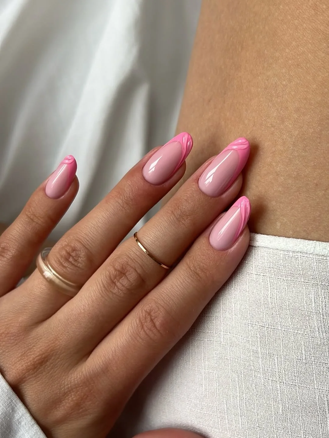 pink summer nails 2026 Minimal Glossy Almond Nails with a Pink Twist