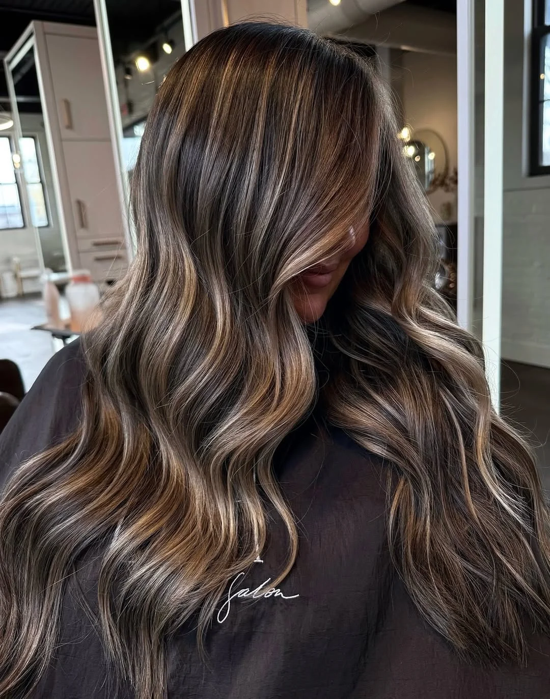 summer hair color ideas to inspire you 2026 Smoky beige ribbons on deep brunette waves
