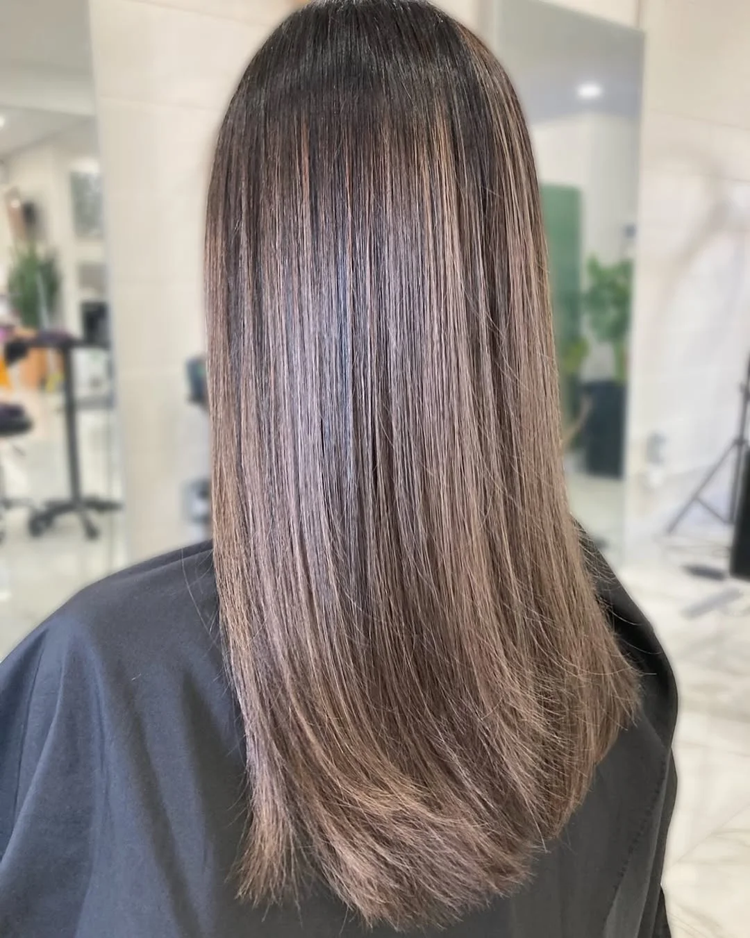 pretty summer mushroom brown hair color 2026 Sleek straight finish with cool-toned dimension