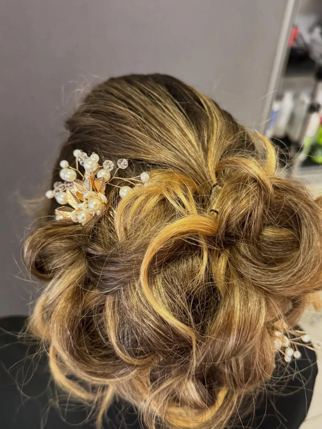 refined summer wedding guest hairstyles 2026 Soft Twisted Updo With Pearl Details