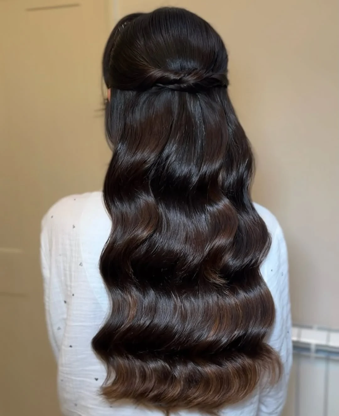 refined summer wedding guest hairstyles 2026 Minimal Sleek Waves With Soft Half-Up Twist