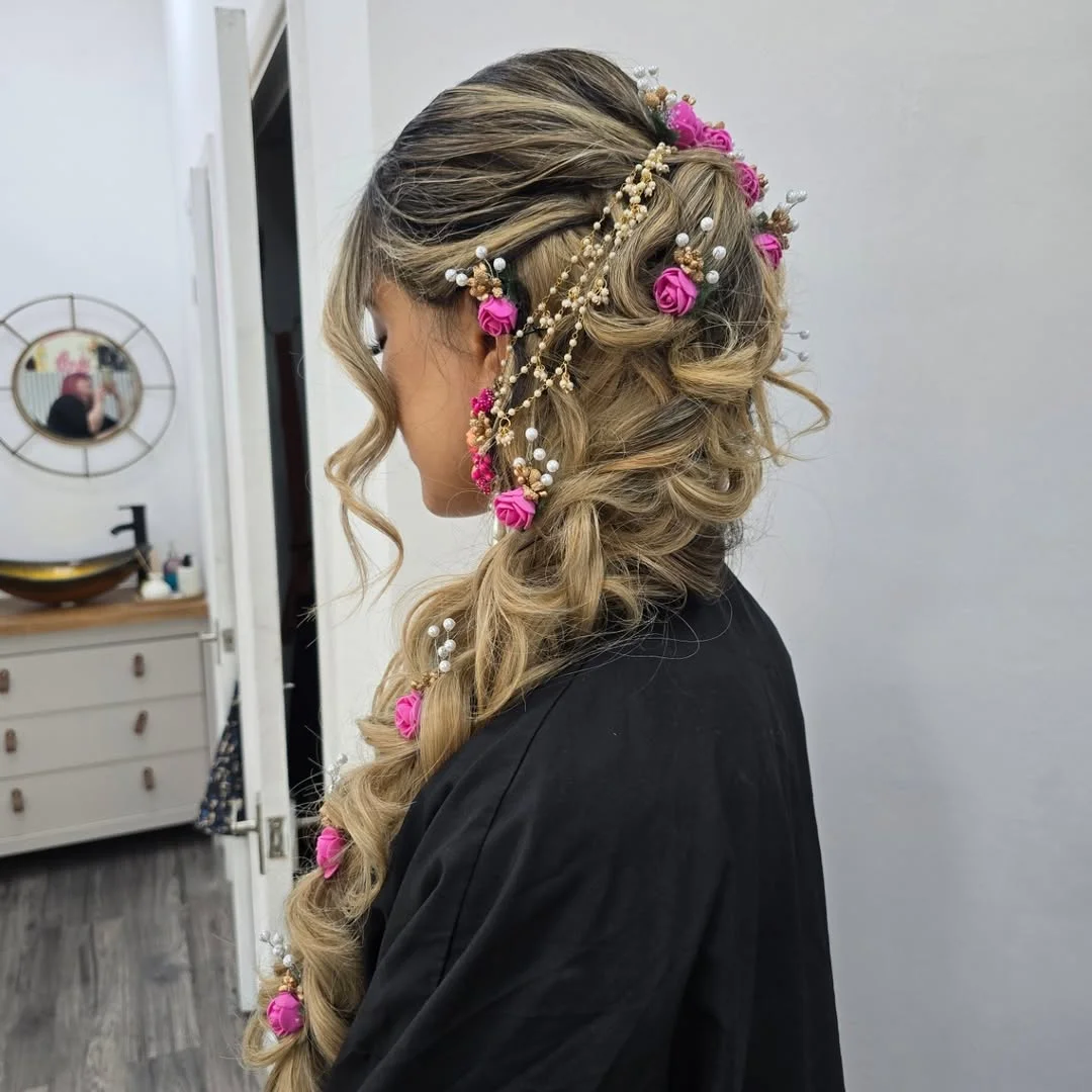 refined summer wedding guest hairstyles 2026 Romantic Floral Braid With Cascading Texture