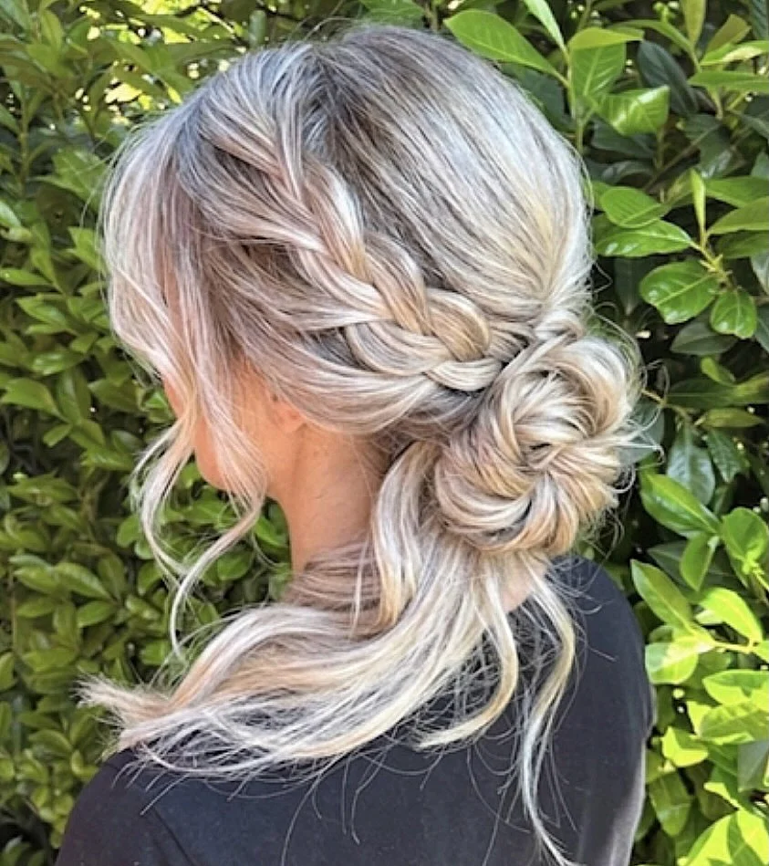 refined summer wedding guest hairstyles 2026 Romantic Braided Low Bun for Medium-Length Hair