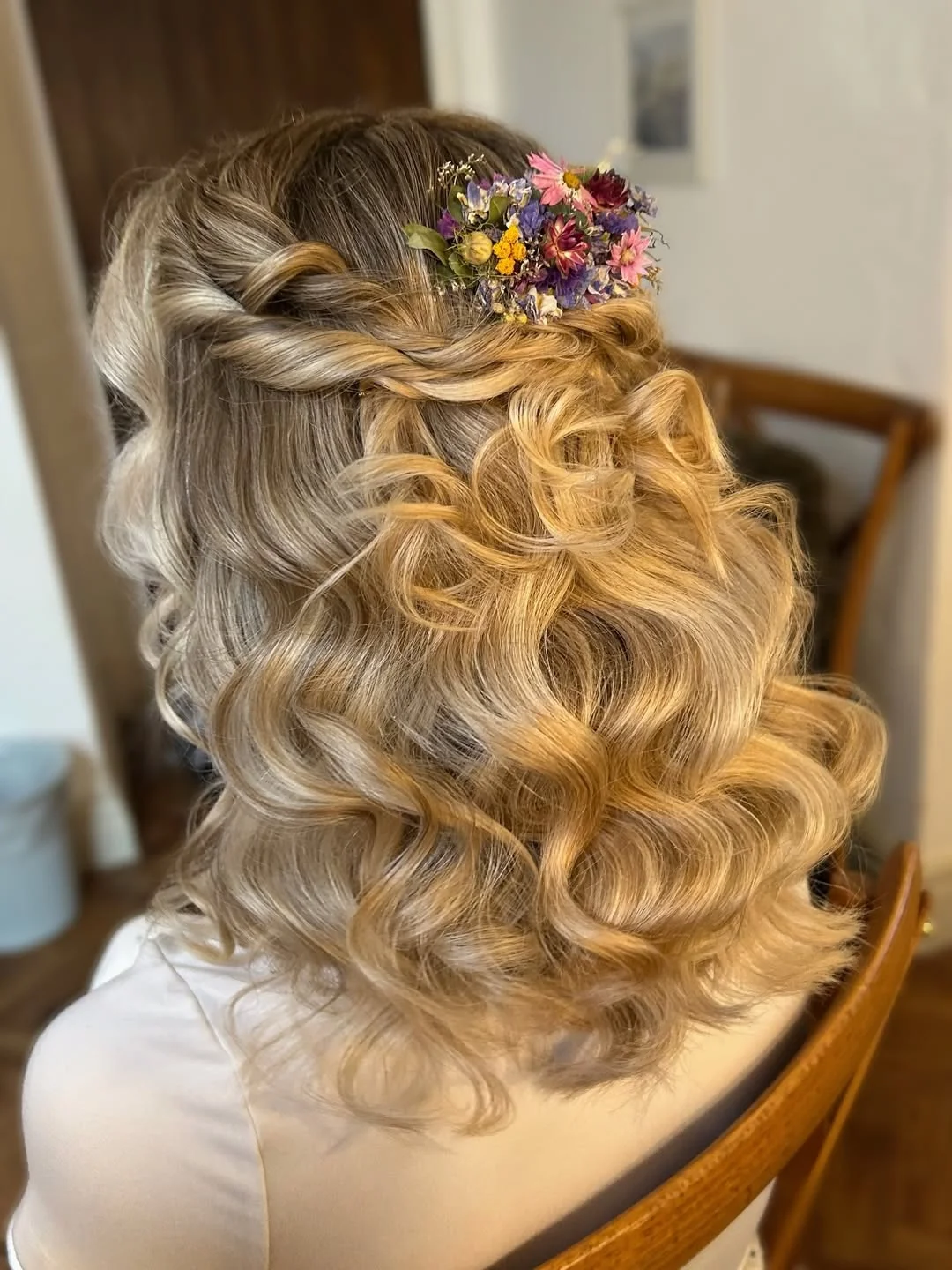 refined summer wedding guest hairstyles 2026 Half-Up Glam Waves With Botanical Texture
