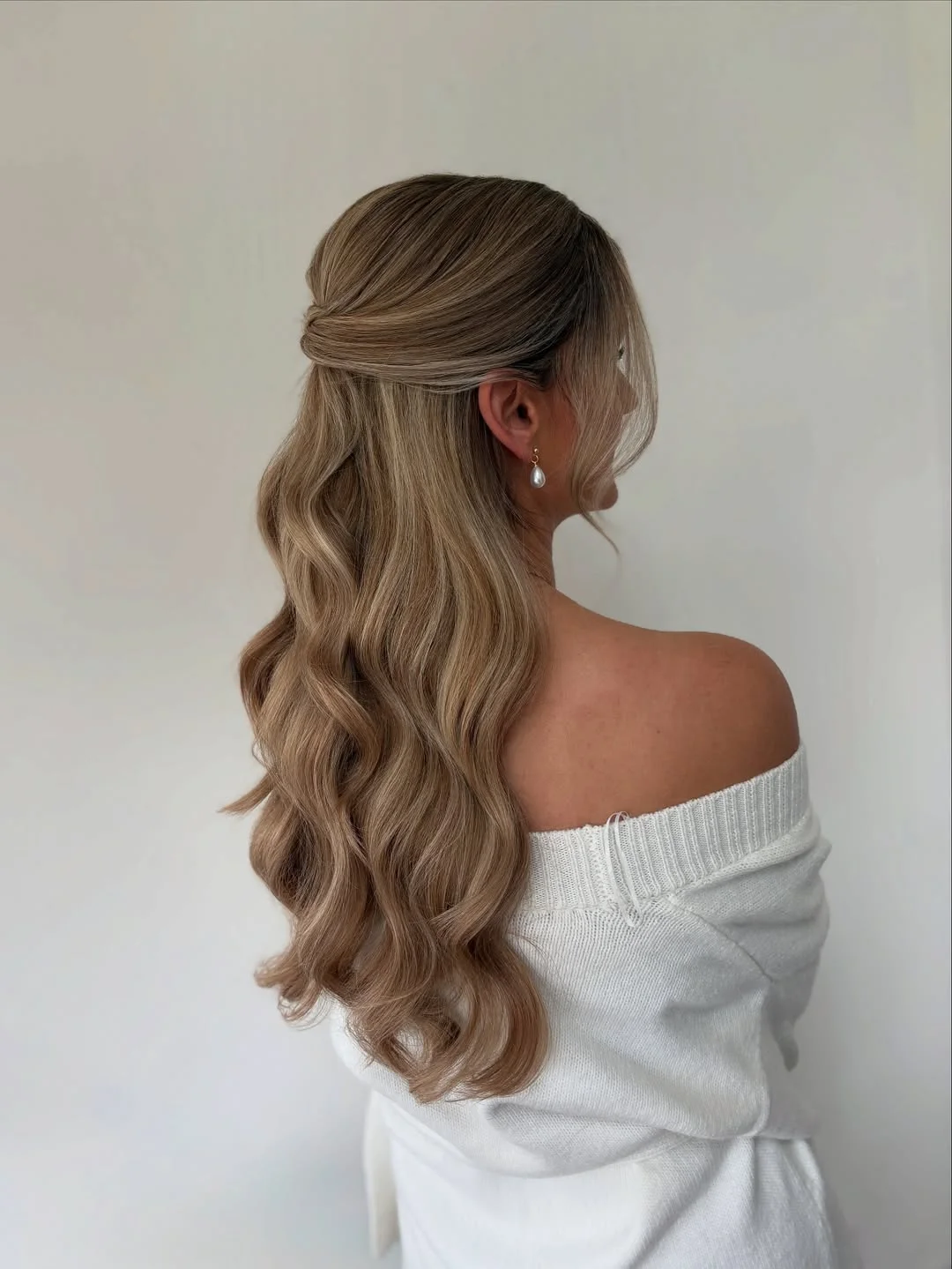 refined summer wedding guest hairstyles 2026 Quiet Luxury Half-Up Waves for Long Summer Evenings