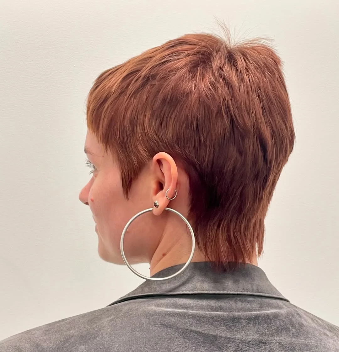 salon summer short haircuts 2026 Soft Auburn Pixie Crop With Tapered Layers
