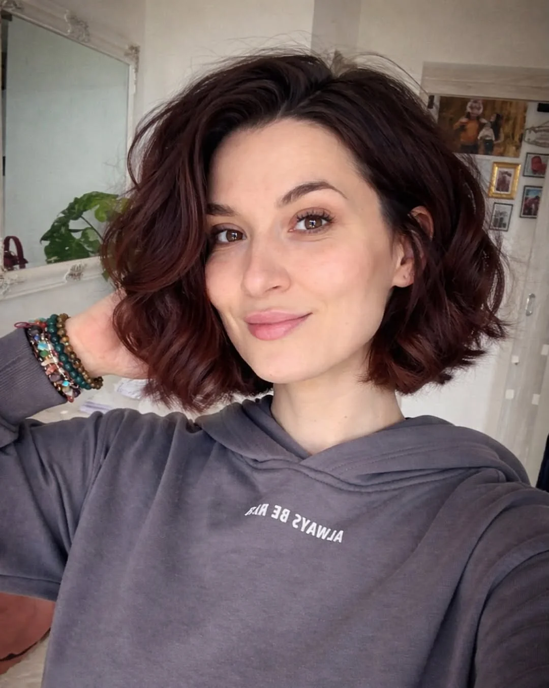 salon summer short haircuts 2026 French Girl Wavy Bob With Deep Cherry Dimension